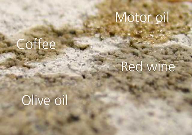 Stains of motor oil, olive oil, red wine and coffee on untreated concrete